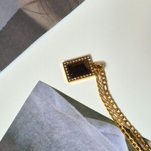 Elegant Gold and Black Pendant Necklace